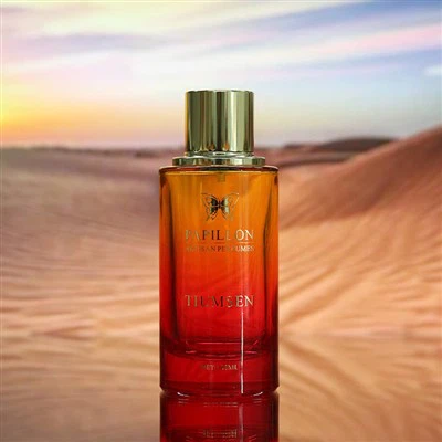 Perfumy w czerwonej, okrągłej butelce